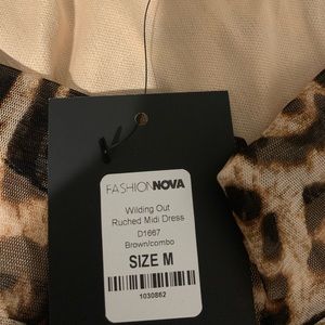 Wilding out mini Ruched dress!